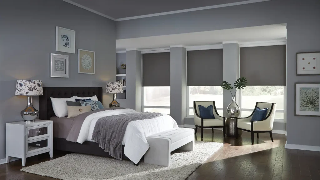 Modern bedroom in soothing grey tones with elegant window treatments